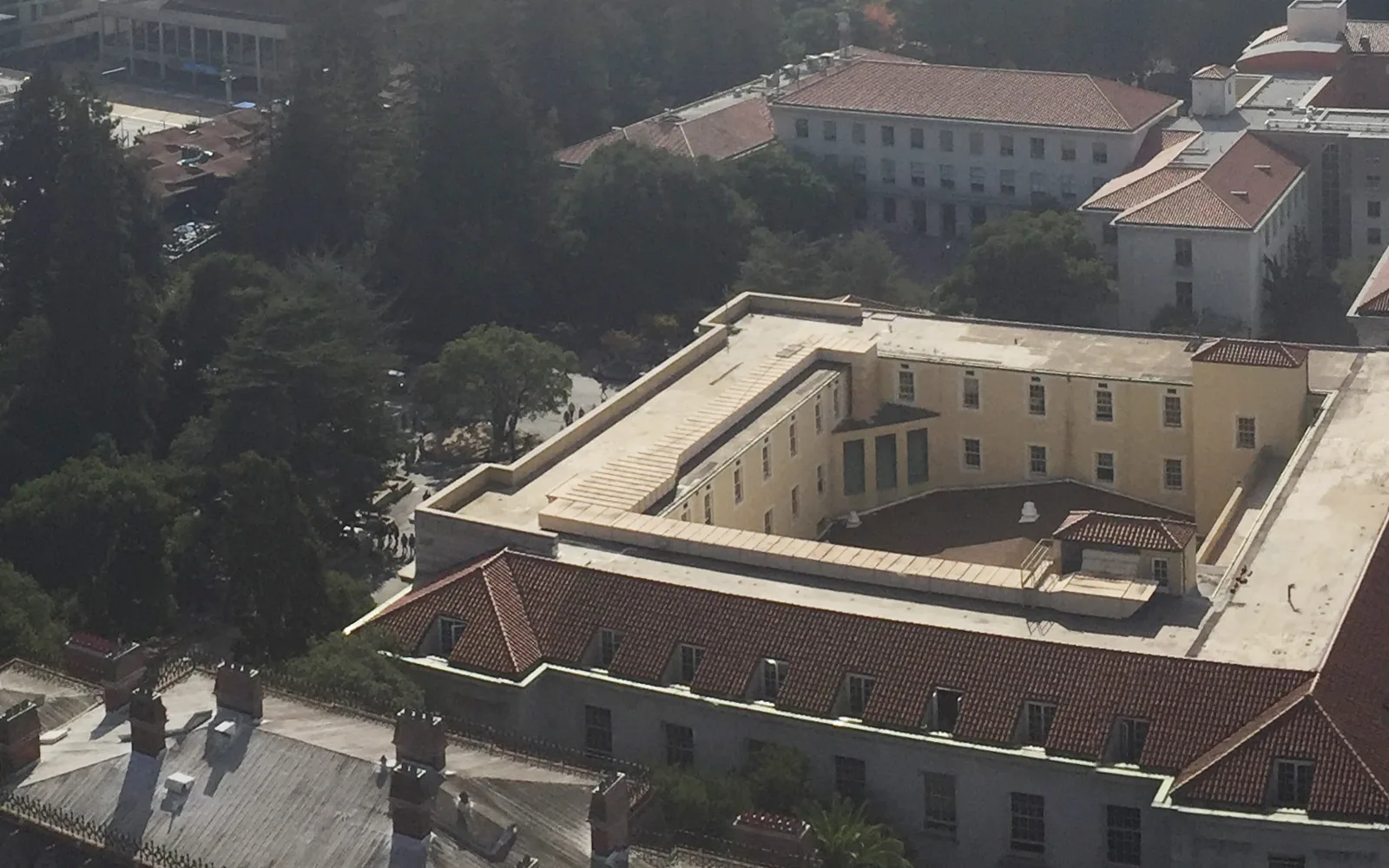 Panoramic view of UC Berkeley campus landscape showing buildings and vegetation across the hillside